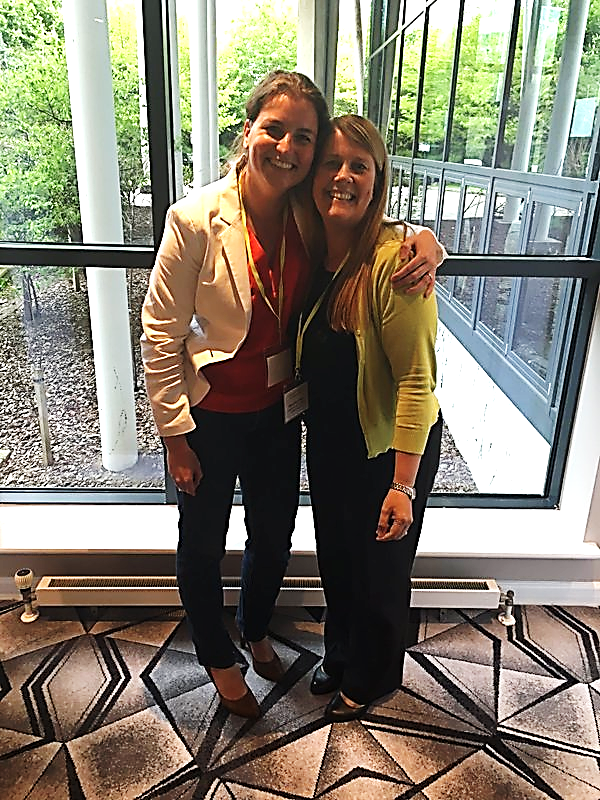 Two ASG colleagues pose for a photograph at a Servitization event