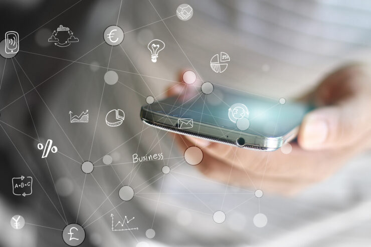 A smartphone with icons of different apps it can access erupting from it.