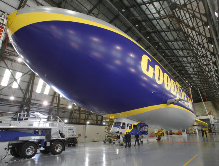 A Goodyear Blimp in an aircraft hanger