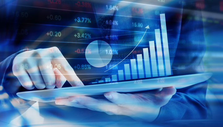 A graph and data appear to float above a tablet screen