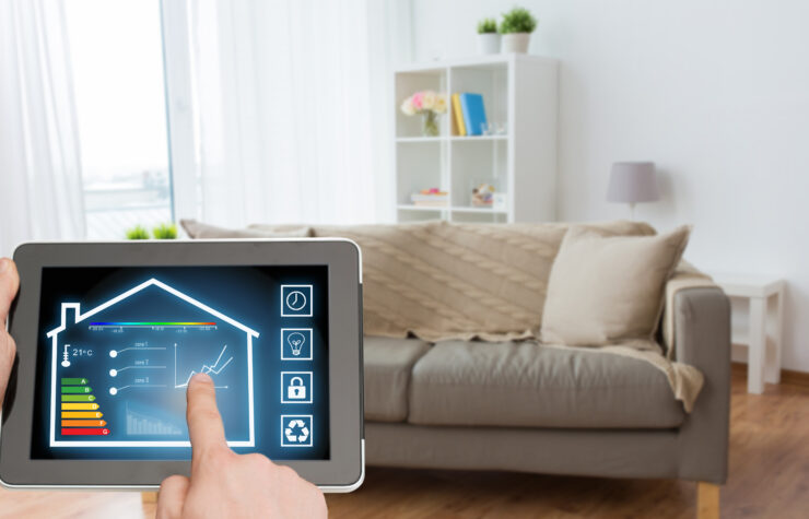 Energy units of a home displayed on a tablet in front of a couch