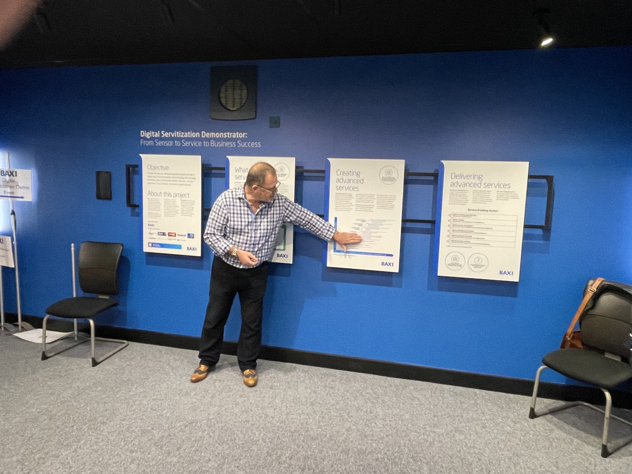 ASG digital servitization demonstrator stand at an event being led by an ASG rep